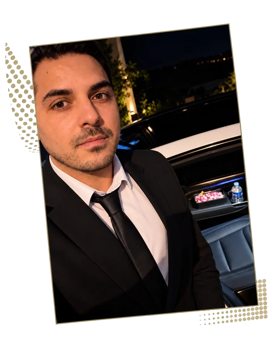 Driver in a suit and tie near a vehicle