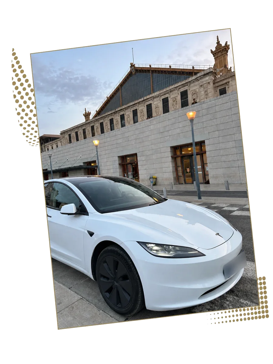White Tesla Model 3 in front of Saint-Charles train station in Marseille