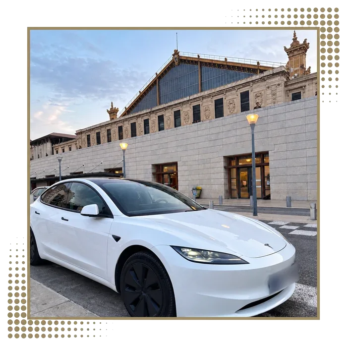White Tesla Model 3 in front of Saint-Charles train station in Marseille